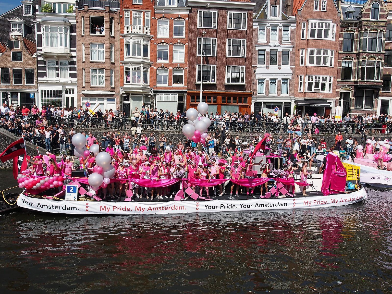 Participants on a boat at Amsterdam Pride Canal Parade in 2017; archival photograph, not the 2026 event.